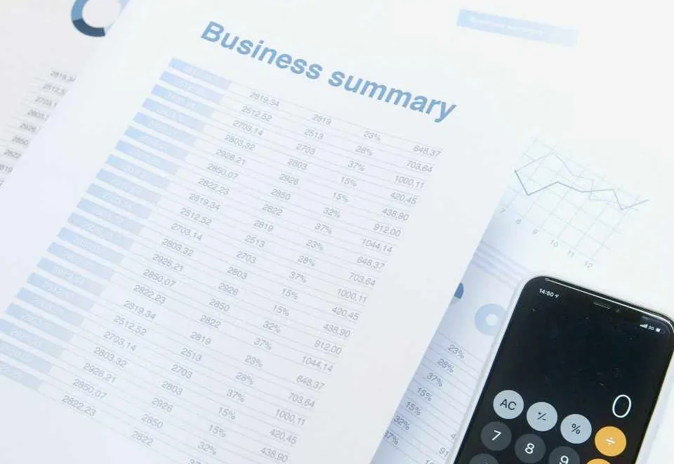 Close-up of business paperwork and a calculator
