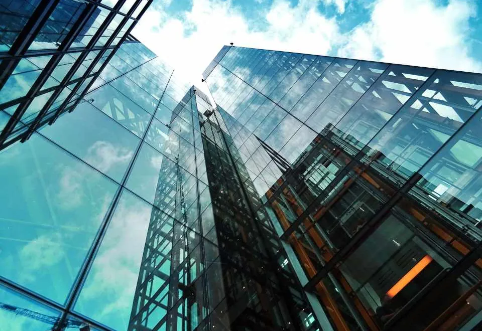 Geometric glass architecture against the sky